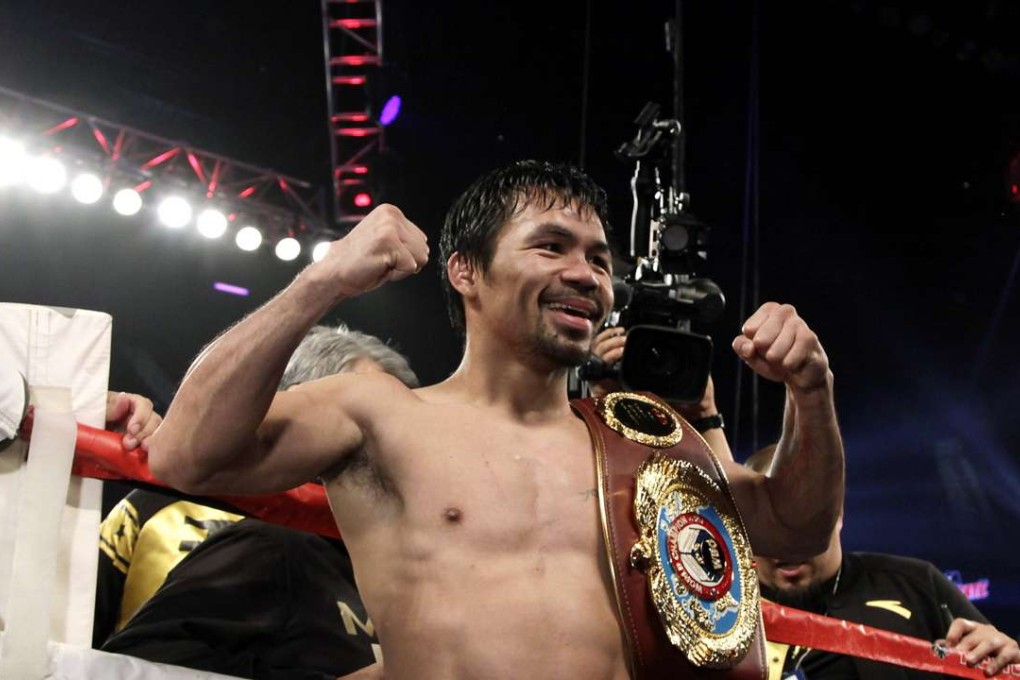 In his last fight in November, Manny Pacquiao celebrates reclaiming the World Boxing Organisation welterweight title for the third time with a unanimous-decision victory over former champion Jessie Vargas in Las Vegas. Photo: AFP