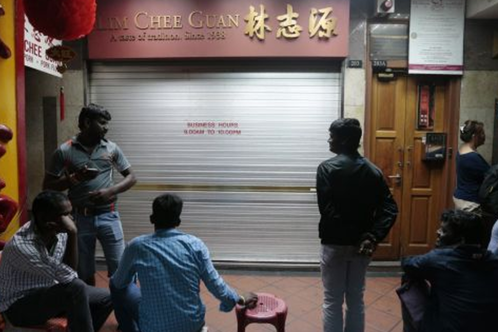 Foreign workers queuing up for bakkwa in Singapore's Chinatown. Photo: Jason Quah/TODAY