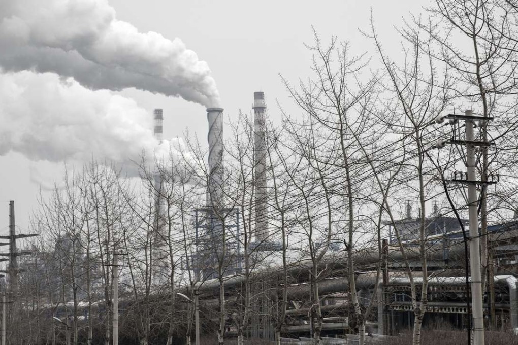 A file picture of smoke billowing from the chimneys of a factory in Dalian. Photo: Bloomberg
