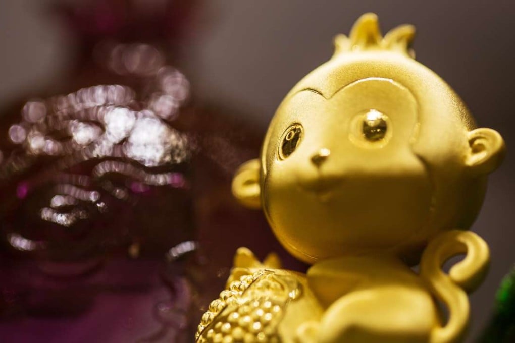 A gold monkey figurine on display at a Chow Tai Fook Jewellery in Hong Kong. Photo: Bloomberg