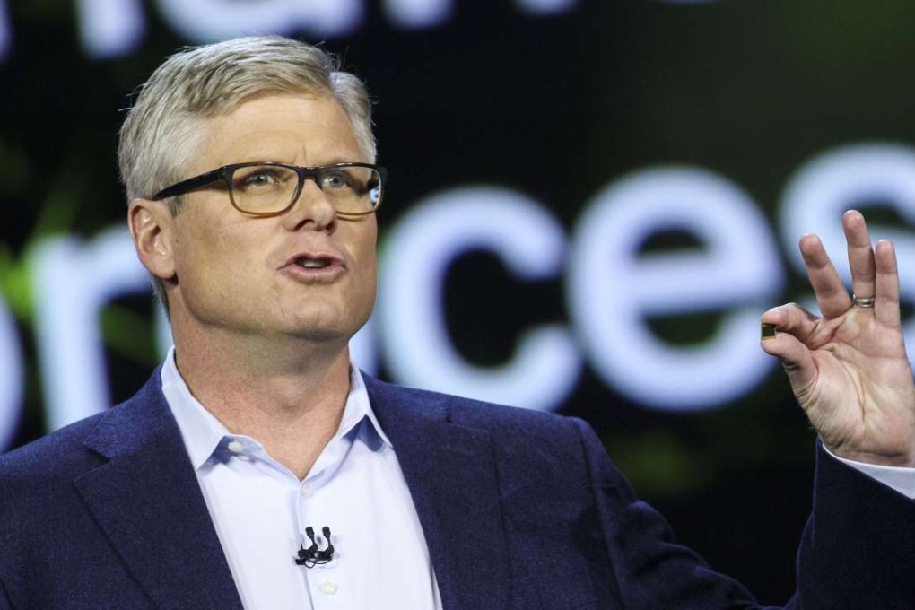 Steve Mollenkopf, chief executive officer of Qualcomm Inc., holds the new Snapdragon 835 chip during a keynote at the 2017 Consumer Electronics Show (CES) in Las Vegas, Nevada. Photo: Bloomberg