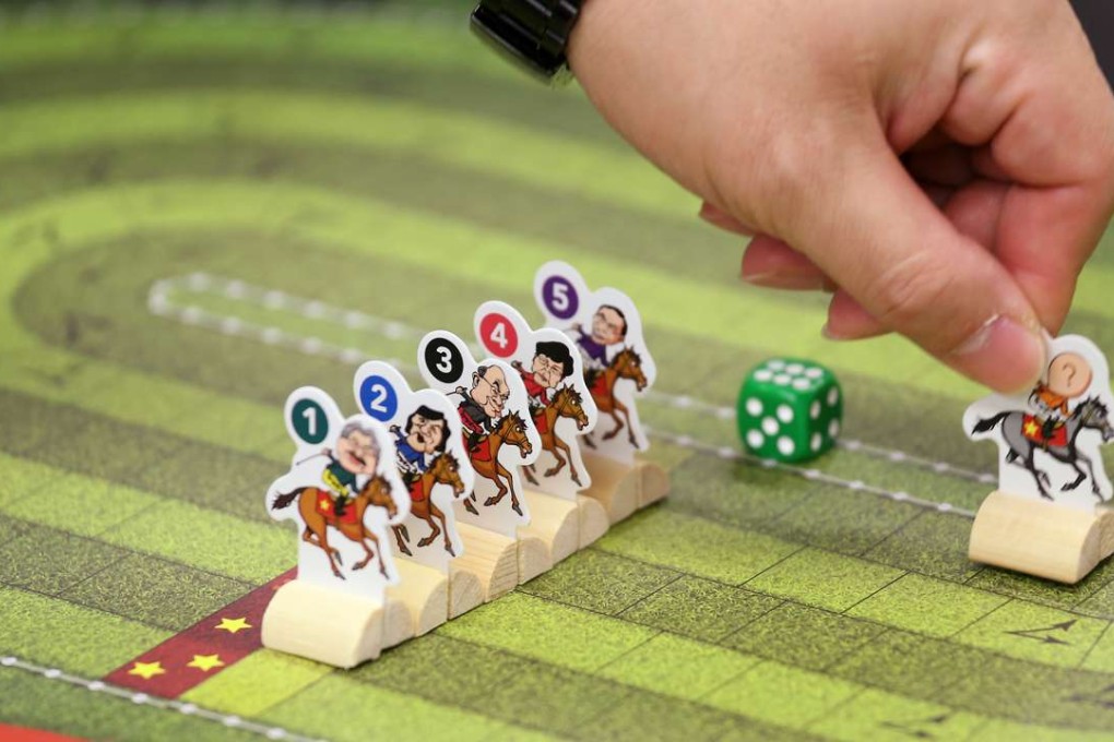 The Labour Party last week demonstrates a game based on the chief executive election it plans to sell at its Lunar New Year fair stall. Photo: K.Y. Cheng