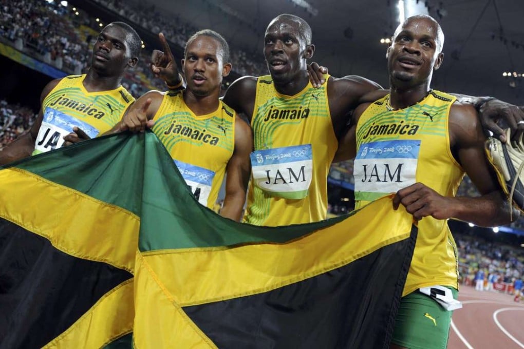 Jamaica’s 4x100m relay team of Asafa Powell, Usain Bolt, Michael Frater, Nesta Carter celebrate after winning gold at the Beijing Olympics in 2008. Photo: Reuters