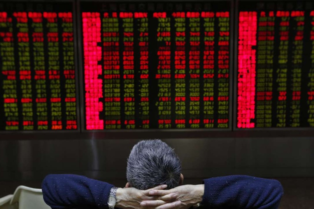 An electronic screen showing market movements at a Beijing brokerage. Unlike the rest of the world, red denotes positive gains and is a welcoming hue in China’s stock market. Photo: EPA