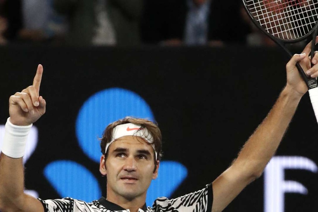 Roger Federer celebrates after defeating compatriot Stan Wawrinka. Photo: AP
