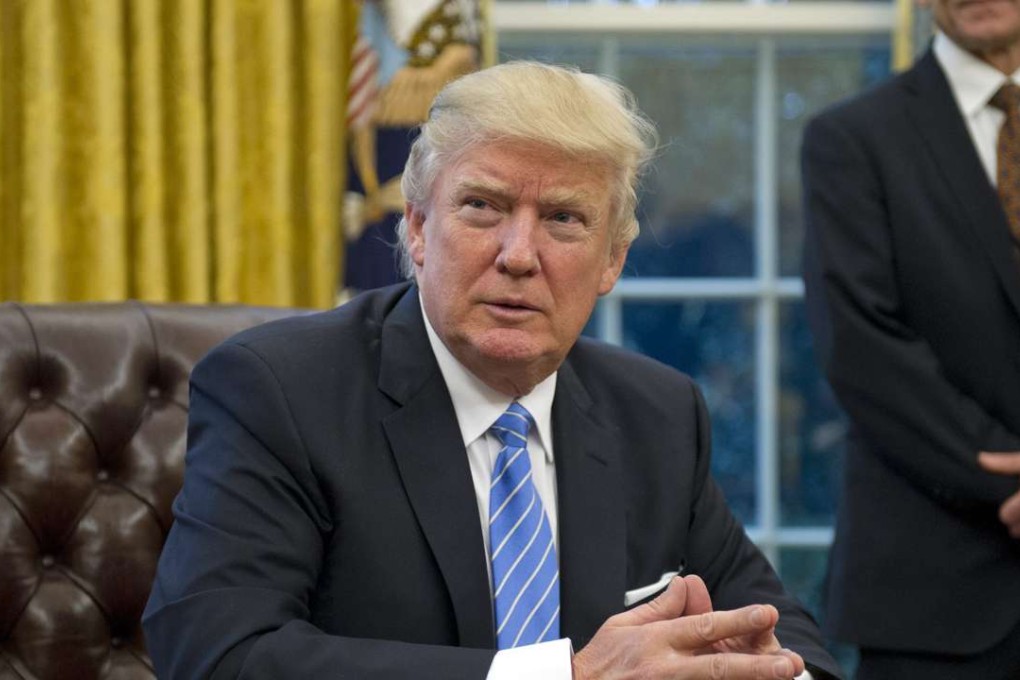 Days after his inauguration, US President Donald Trump signed three Executive Orders, the withdrawal of the United States from the Trans-Pacific Partnership (TPP), a US Government hiring freeze for all departments but the military, and "Mexico City" which bans federal funding of abortions overseas. Photo: EPA