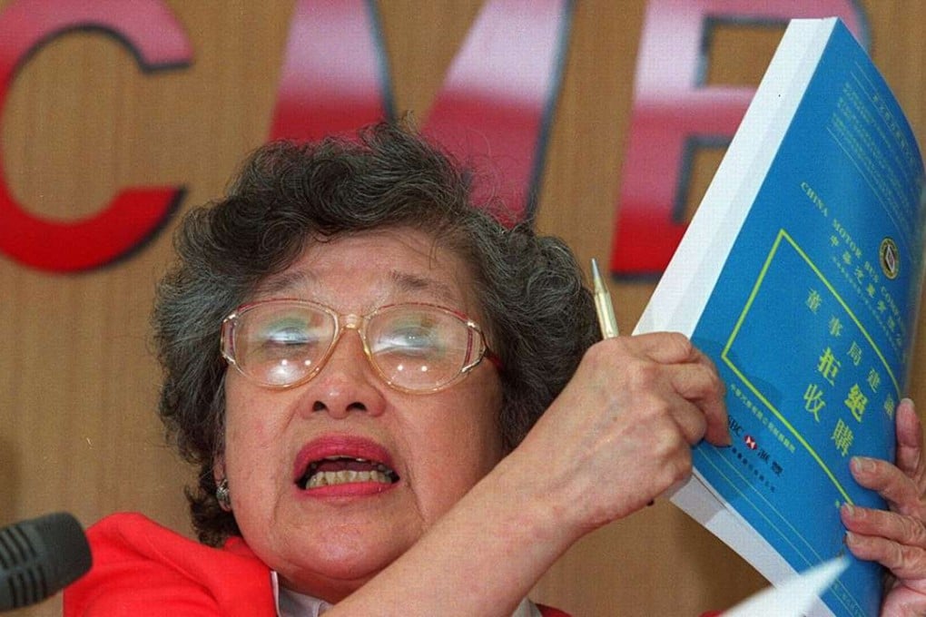 File photo of CMB’s Irene Ngan Kit-ling at a 2002 news conference as she explains why the company is rejecting a hostile bid by offering to pay a special dividend. Photo: SCMP Pictures