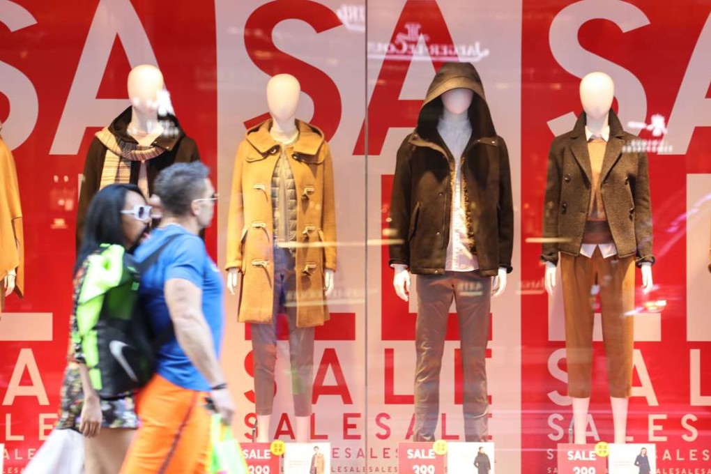 Huge signs advertise discounts at a Causeway Bay store on January 2. Promises of bargains are often hard to resist, with so much advertising in our faces and shops everywhere. Photo: Felix Wong
