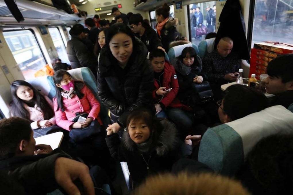 Getting a seat on a train before Lunar New Year can be tricky without using a ticketing app, some say. Photo: EPA