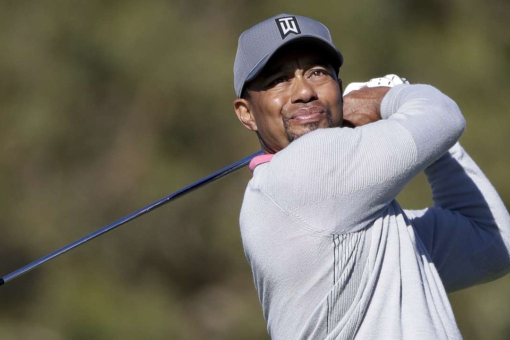 Tiger Woods watches his tee shot during the second round of the Farmers Insurance Open. Photo: AP
