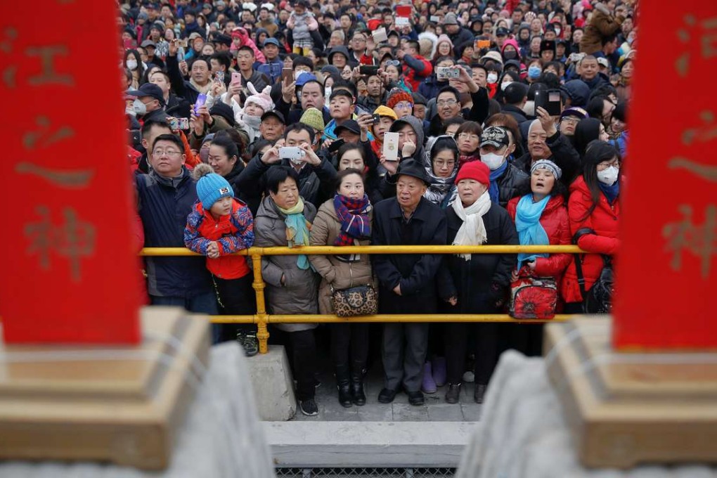 People gather for celebrations at the temple fair at Ditan Park in Beijing on Saturday. Photo: Reuters