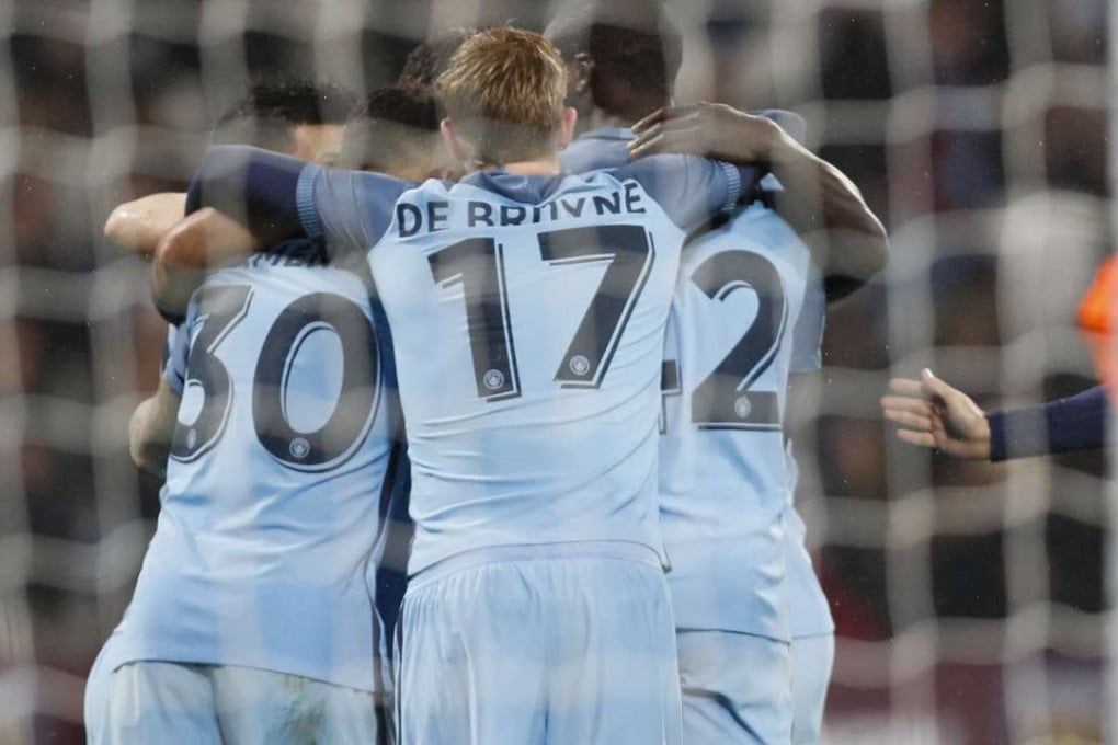 Players of Manchester City celebrate a score during the third round match of the FA Cup against West Ham United. Photo: Xinhua