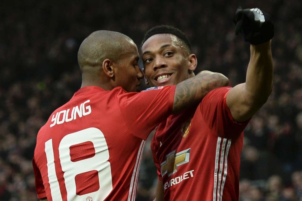 Manchester United's French striker Anthony Martial (right) celebrates with Ashley Young. Photo: AFP