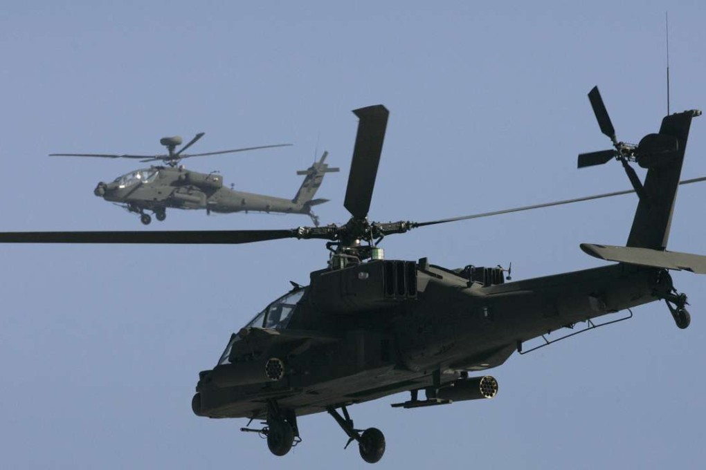 US Army Apache attack helicopters participate in an aerial gunnery training exercise. An official with al-Qaida said the Apache attack helicopters struck the area from the air before dropping commandos in for the raid. File photo: Reuters