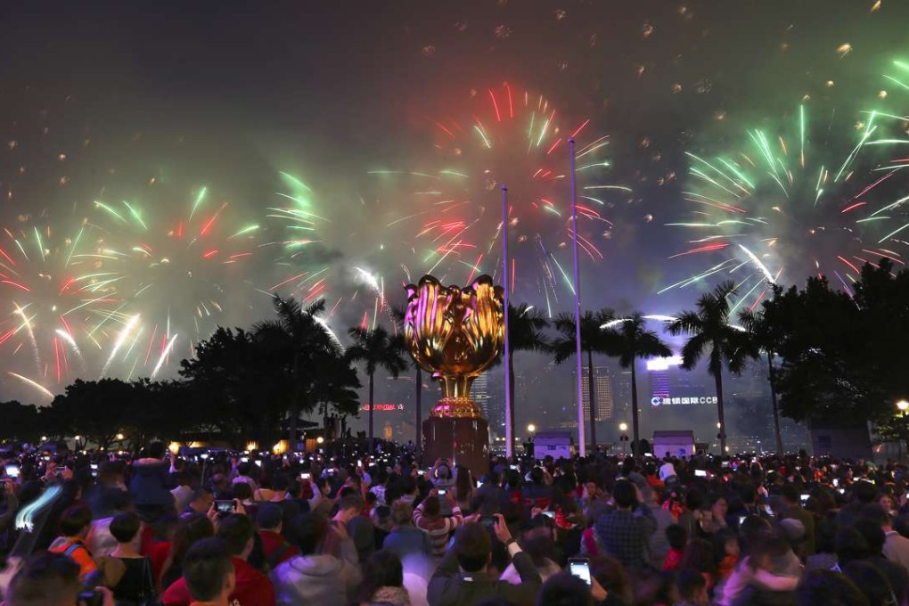 The fireworks display over Victoria Harbour celebrating the Lunar New Year is shrouded by mist. Photo: Dickson Lee