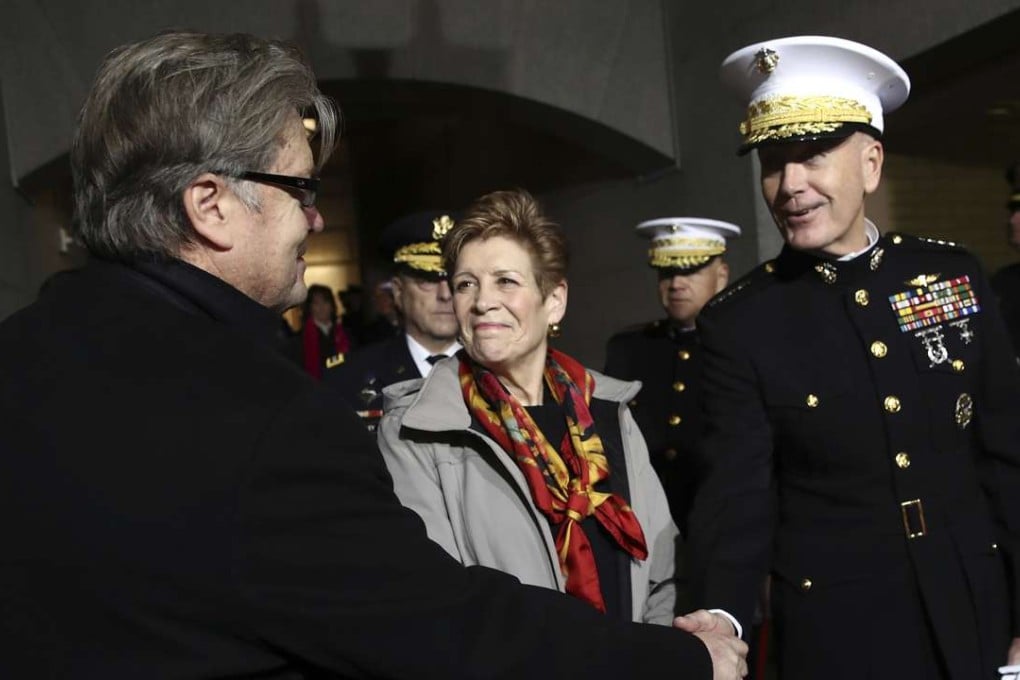 Steve Bannon, left, and Chairman of the US Joint Chiefs of Staff ,General Joseph F. Dunford, arrive at the US Capitol on January 20 in Washington, for the inauguration ceremony of Donald Trump. Bannon has become a principal member of the US National Security Council, while Dunford has lost his permanent position on the council Photo: AP