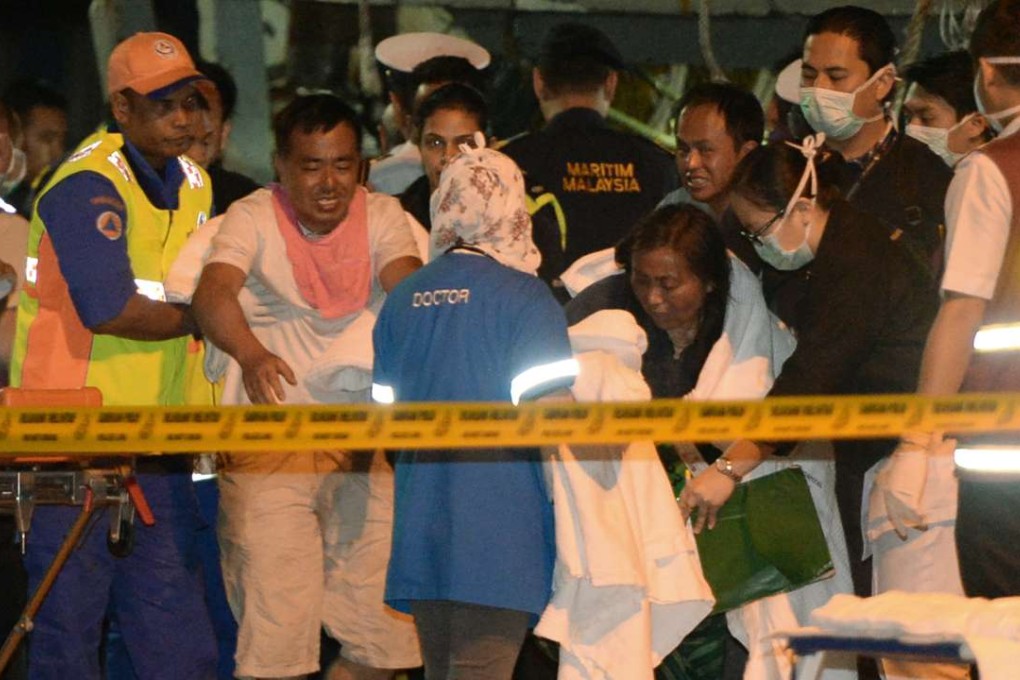 Survivors arrive in Kota Kinabalu, Malaysia, after their boat sank off the coast of Borneo. Photo: Xinhua