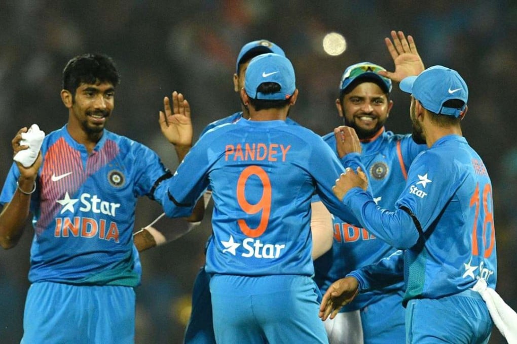 India’s Jasprit Bumrah (left) celebrates with teammates after winning the second T20 match between India and England. Photo: AFP