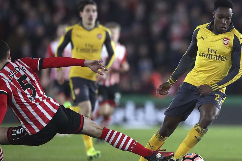 Arsenal's Danny Welbeck (right) battles for the ball with Southampton's Florin Gardos. Photo: AP