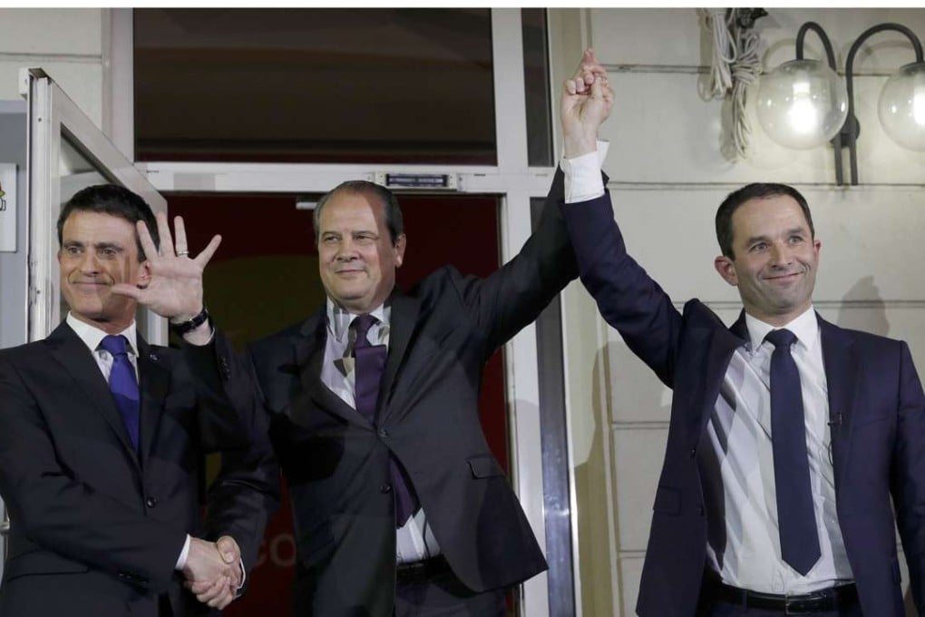 Former French education minister Benoit Hamon (right) is declared winner of the second round of the French left's presidential primary election, over former prime minister Manuel Valls (left), with French Socialist Party First Secretary Jean-Christophe Cambadelis in the centre of this picture at their party headquarters in Paris, on Sunday. Photo: Reuters