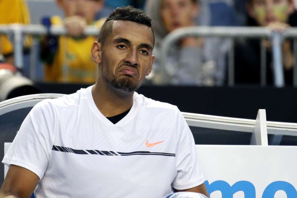 Australia’s Nick Kyrgios reacts while sitting in his chair his ill-fated Australian Open campaign. Photo: AP