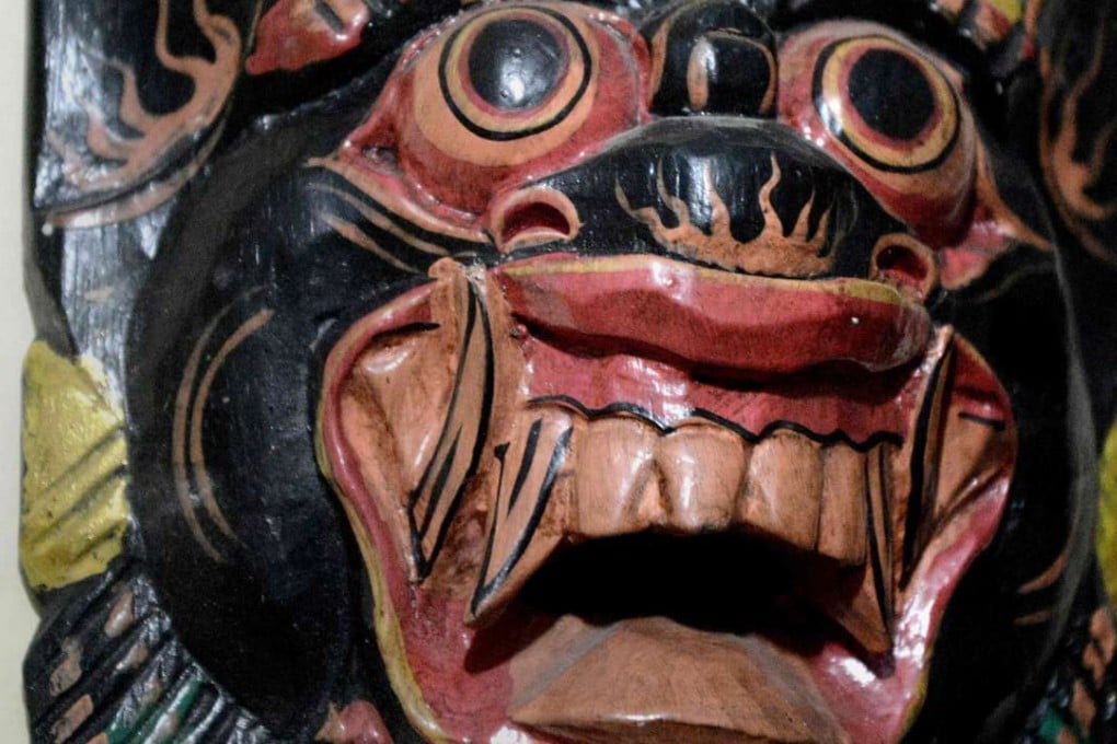 A mask among other paraphernalia used by Indonesian faith healer Ki Raksa Manggala, who operates from a dark basement in Jakarta. Photo: AFP