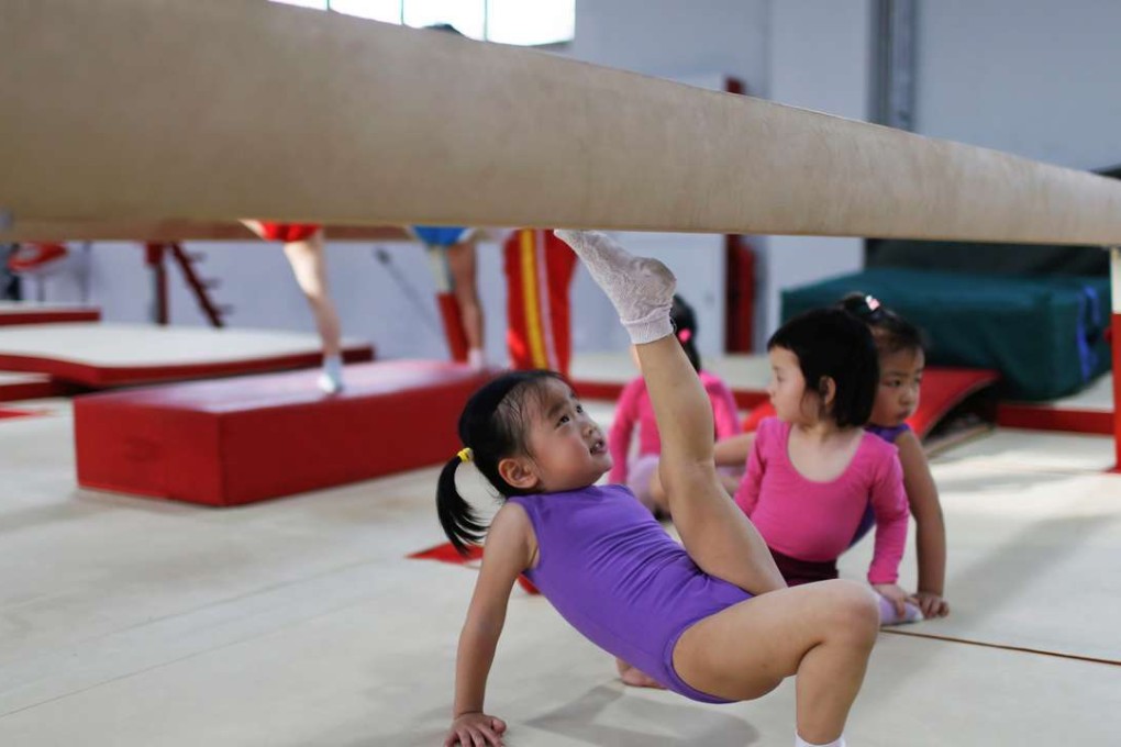 Young gymnasts practise their routines at the Shanghai Yangpu Youth Amateur Athletic School last May. Photo: Reuters