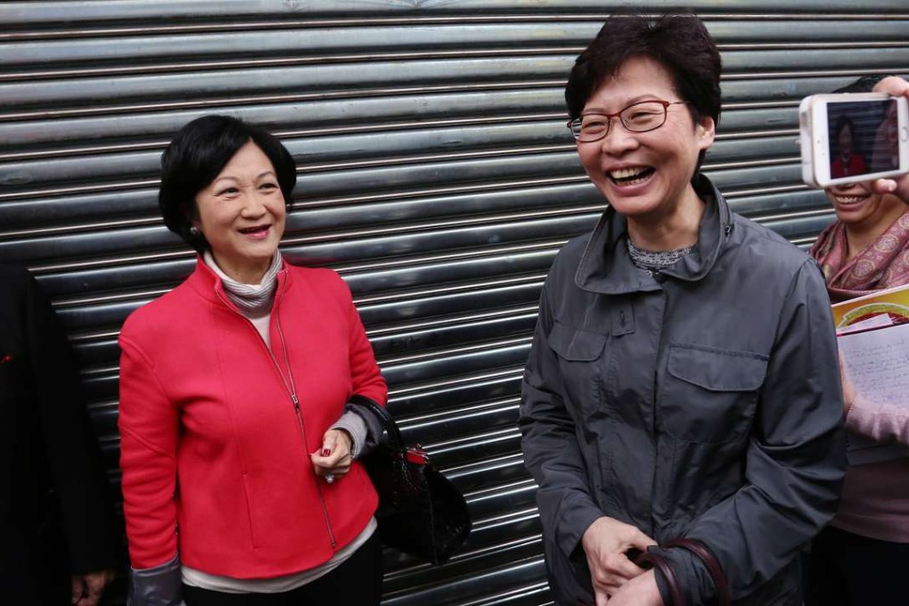 Regina Ip (left) and Carrie Lam run into each other in Aberdeen, where they were meeting Election Committee members from the agriculture and fisheries subsector. Photo: Jonathan Wong