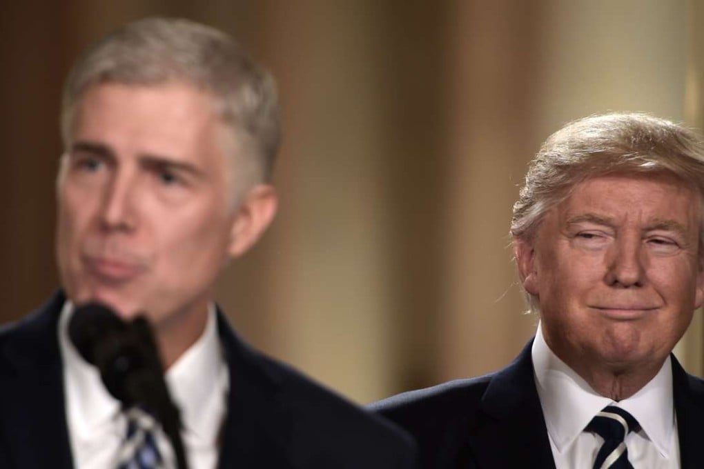 Judge Neil Gorsuch (left) speaks after US President Donald Trump (right) nominated him for the Supreme Court, at the White House on Tuesday. Photo: AFP