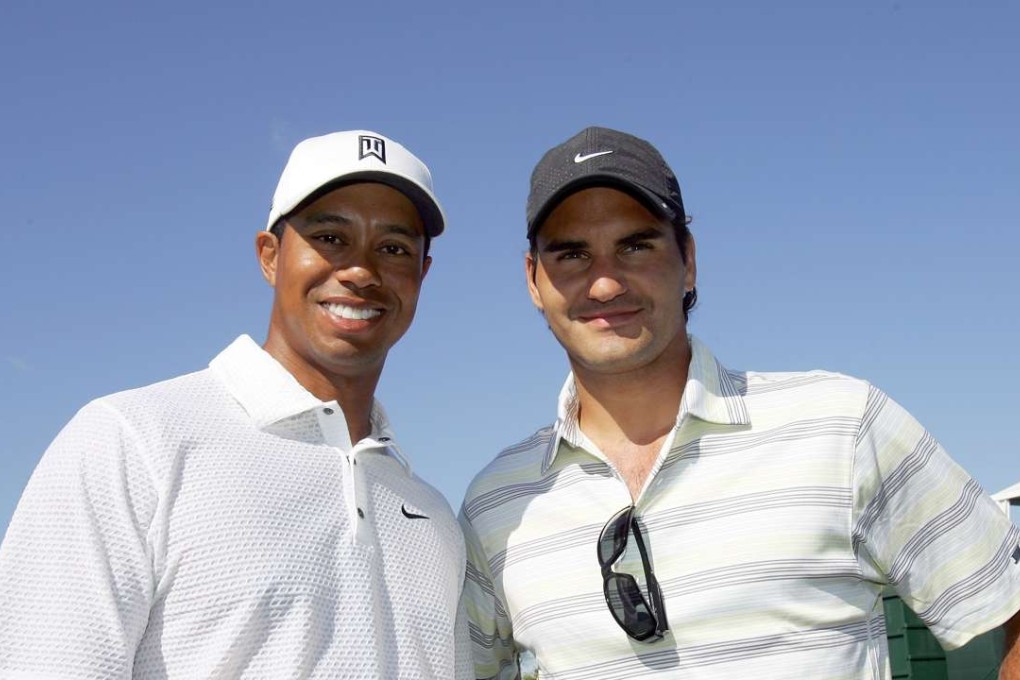 Tiger Woods poses with Roger Federer at the CA World Golf Championships in 2007. Photo: AFP