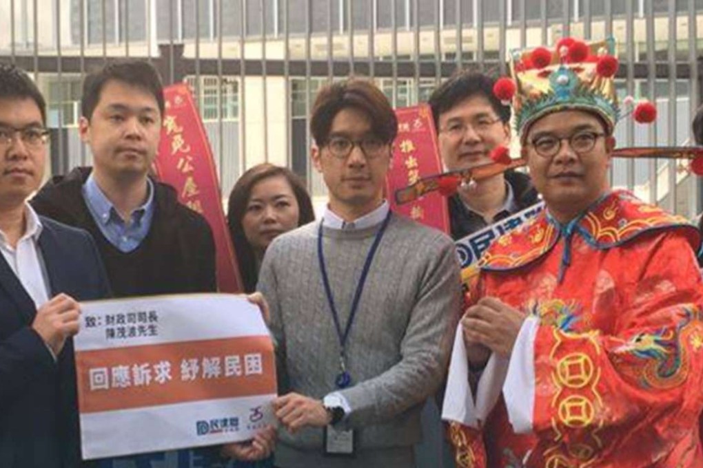 Members of the DAB stage a budget protest at government headquarters. Photo: Facebook