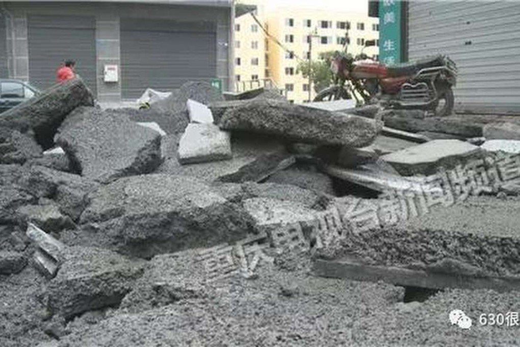 Rubble covers a street in Chongqing after a septic tank explosion caused by a lit firecracker. Photo: Cq.sina.com