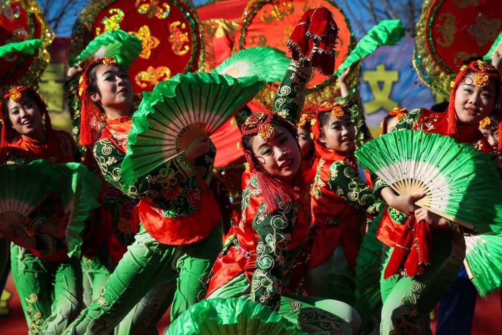 Dancers in traditional costume perform at Longtan Park in Beijing as part of festivities to mark the New Year, also called the Spring Festival in China, on January 30. Photo: EPA