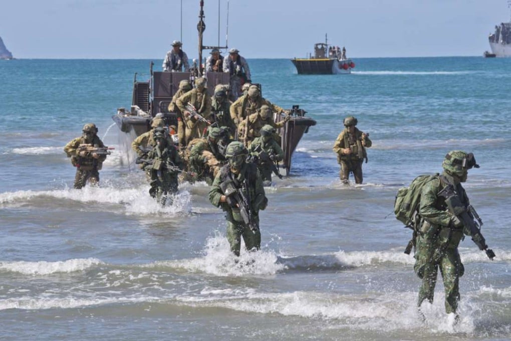 Australian Army soldiers from 7th Battalion, Royal Australian Regiment, and Singapore Army soldiers disembark a Fast Craft Utility landing vessel at Shoalwater Bay training area, Queensland. Photo: Handout