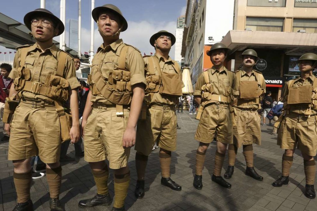 Watershed Hong Kong members in the uniforms of the Hong Kong Volunteer Defence Corps, in Tsim Sha Tsui, in December. Picture: Jonathan Wong