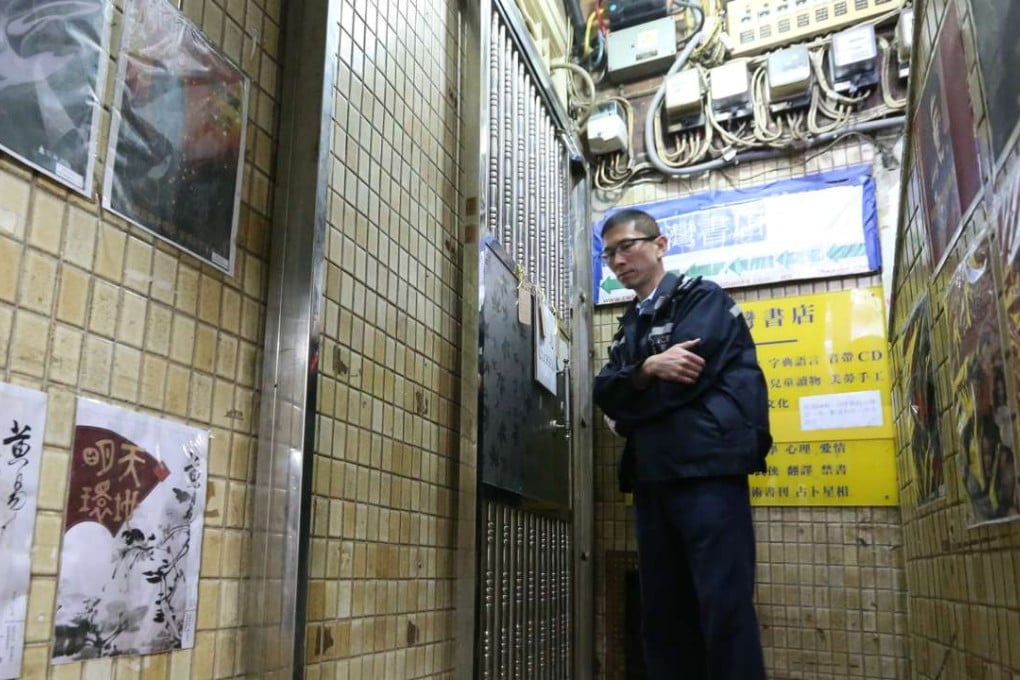 A police officer outside the closed gates of Causeway Bay Books, the publisher involved in the missing booksellers case that rocked Hong Kong. Photo: Felix Wong