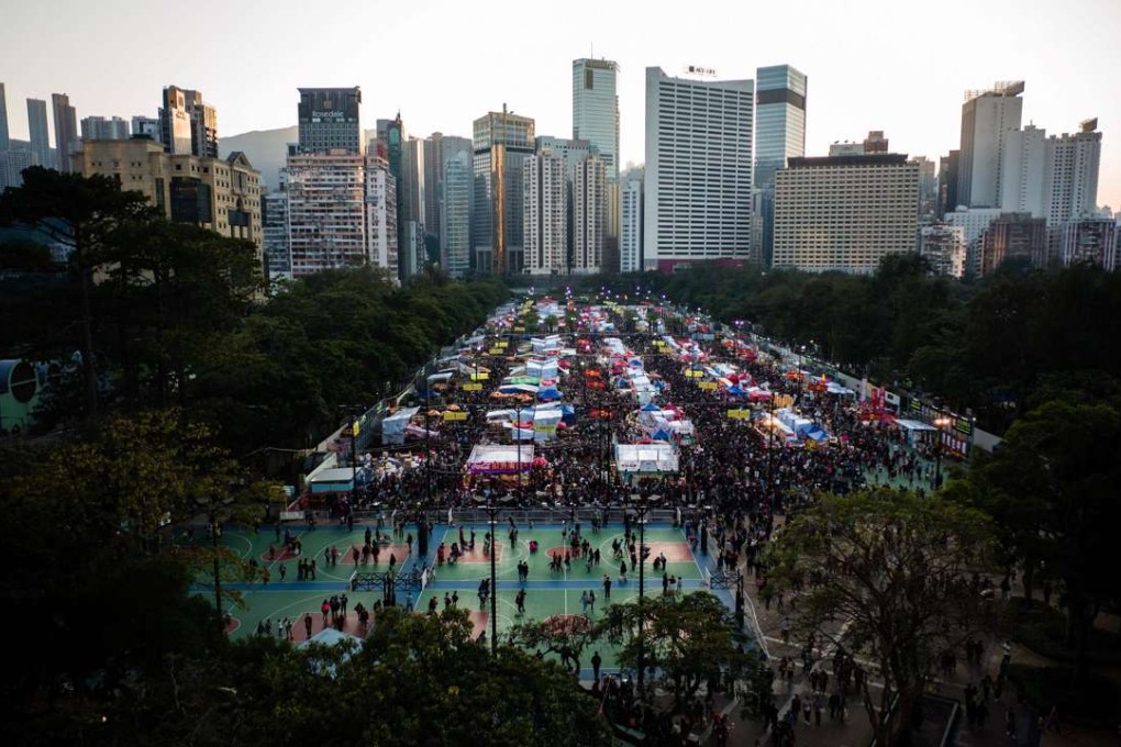 Hong Kong people throng the Victoria Park New Year flower market on January 27, on the eve of the Lunar New Year holiday. Victoria Park already offers a comfortable pedestrian path network and an abundance of sports and recreational facilities. Photo: AFP