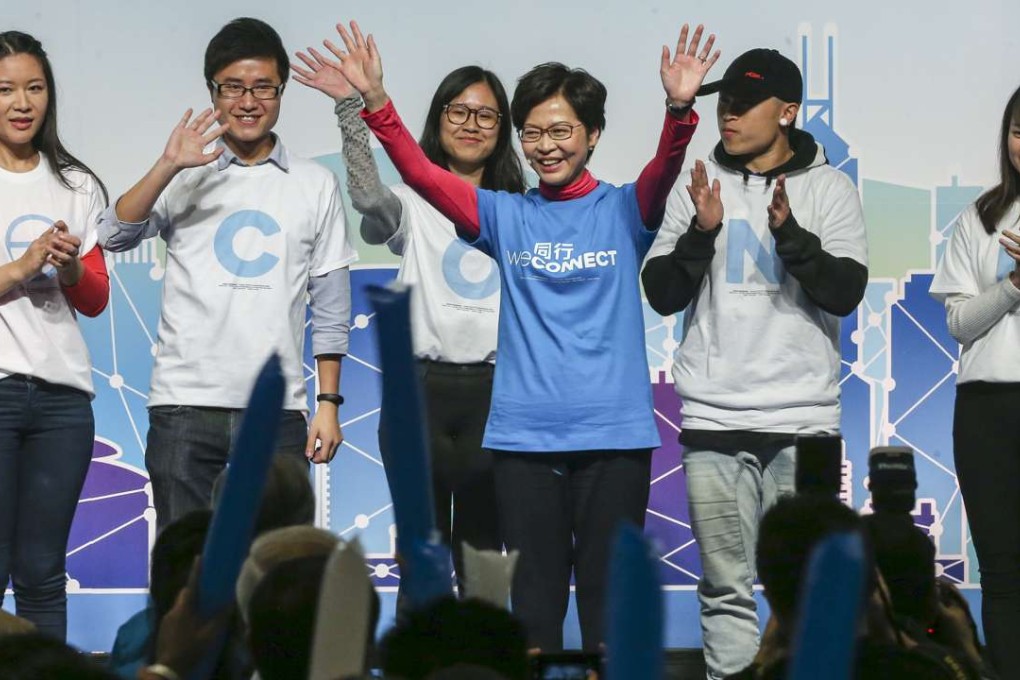 Carrie Lam (middle) at a campaign event held at the Convention and Exhibition Centre on Friday. Photo: Sam Tsang