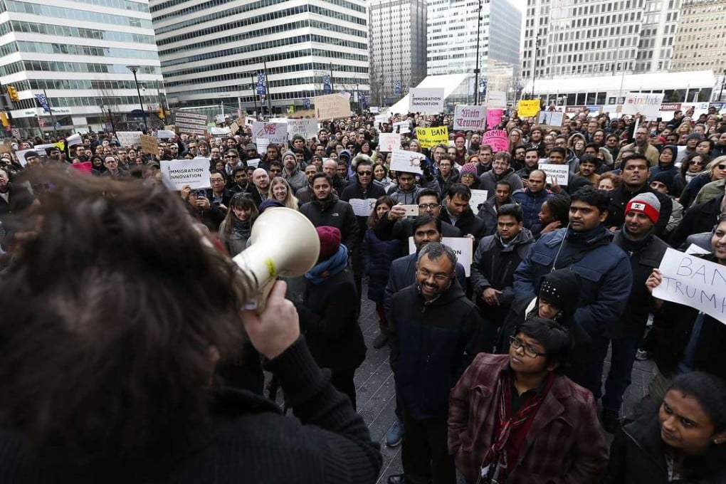 Comcast employees protest President Donald Trump's executive order banning refugees as well as immigrants from seven majority Muslim countries, at Dilworth Park in Philadelphia. Photo: AP