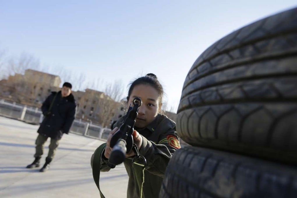 A woman takes part in bodyguard training in 2013. The demand for female bodyguards in China has grown over the past decade. Photo: Reuters