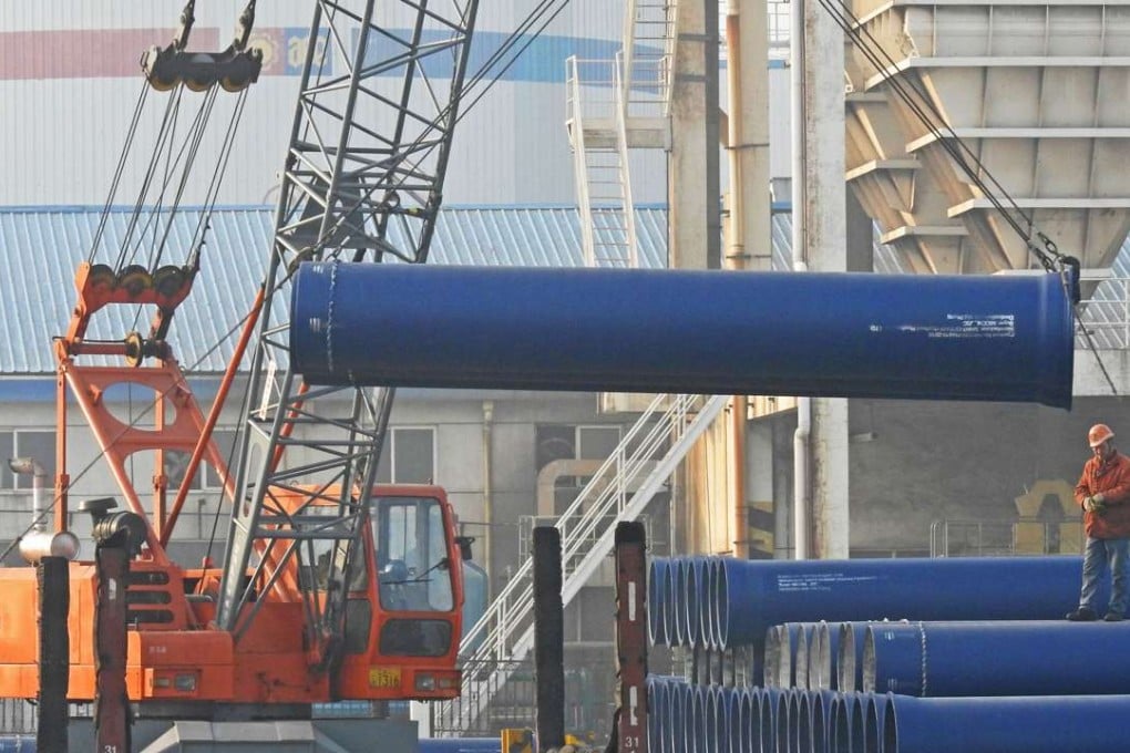 Workers load steel pipes for export at a port in Lianyungang, Jiangsu province. The US Commerce Department announced earlier this week it would impose high punitive tariffs ranging from 63.86 per cent to 190.71 per cent on China’s stainless steel products. Photo: AFP