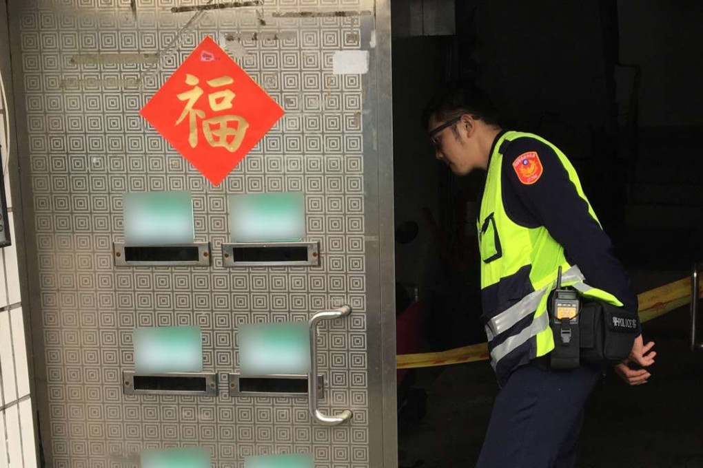 Police investigate the scene where a man killed two of his three children in Taipei, Taiwan. Photo: Handout