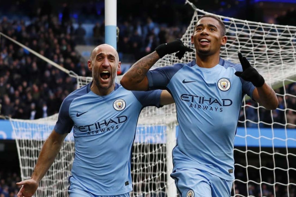 Manchester City's Gabriel Jesus celebrates scoring his team’s second goal with teammate Pablo Zabaleta. Photo: Reuters
