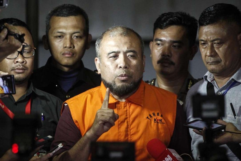 Patrialis Akbar, Indonesia’s former justice minister, speaks to the media after being detained for allegedly receiving bribes from a meat importer seeking to influence the Indonesian Constitutional Court. Photo: AFP