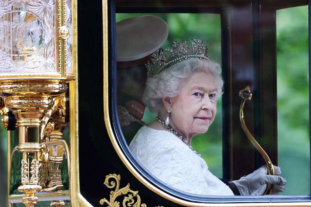 Britain's Queen Elizabeth II, pictured returning to Buckingham Palace by royal carriage along The Mall following her State Opening of Parliament Speech in London in 2014, is the world's longest-reigning monarch and is the first British monarch to reach a Sapphire Jubilee. Photo: EPA