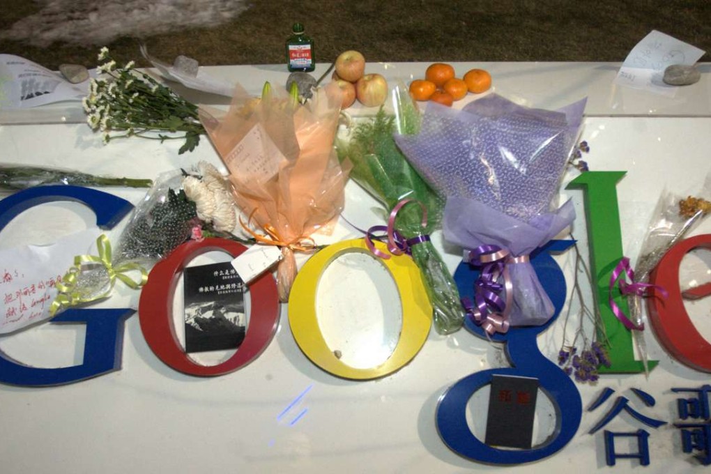 Flowers, fruits and a bottle of liquor, items associated with a traditional Chinese funeral rituals, were placed on Google's logo outside the company's China headquarters in Beijing in 2010, following the company’s announcement that it would withdraw its search engine from China. Photo: AP