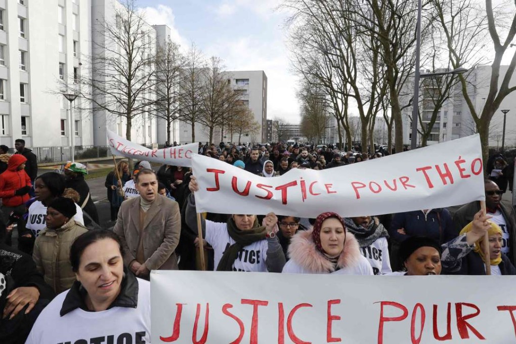 People protest on Monday in Aulnay-sous-Bois, northern Paris, a day after a French police officer was charged with the rape of a youth who was severely injured after allegedly being sodomized with a baton. Photo: AFP