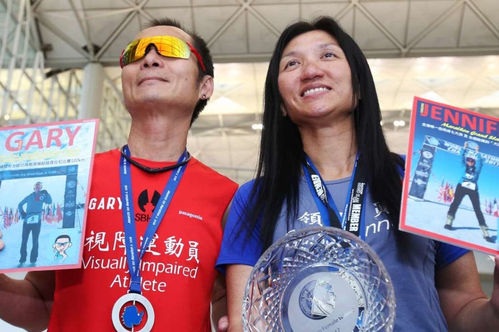Visually impaired athlete Gary Leung Siu-wai and running partner Jennifer Cheung Sze-ying at Hong Kong international airport after Leung became the first visually impaired athlete to complete a special 100km race in the South Pole, on January 30. The pair took part in the super race, a part of the World Marathon Challenge 2017, to raise funds for Samaritan Befrienders Hong Kong. Photo: David Wong