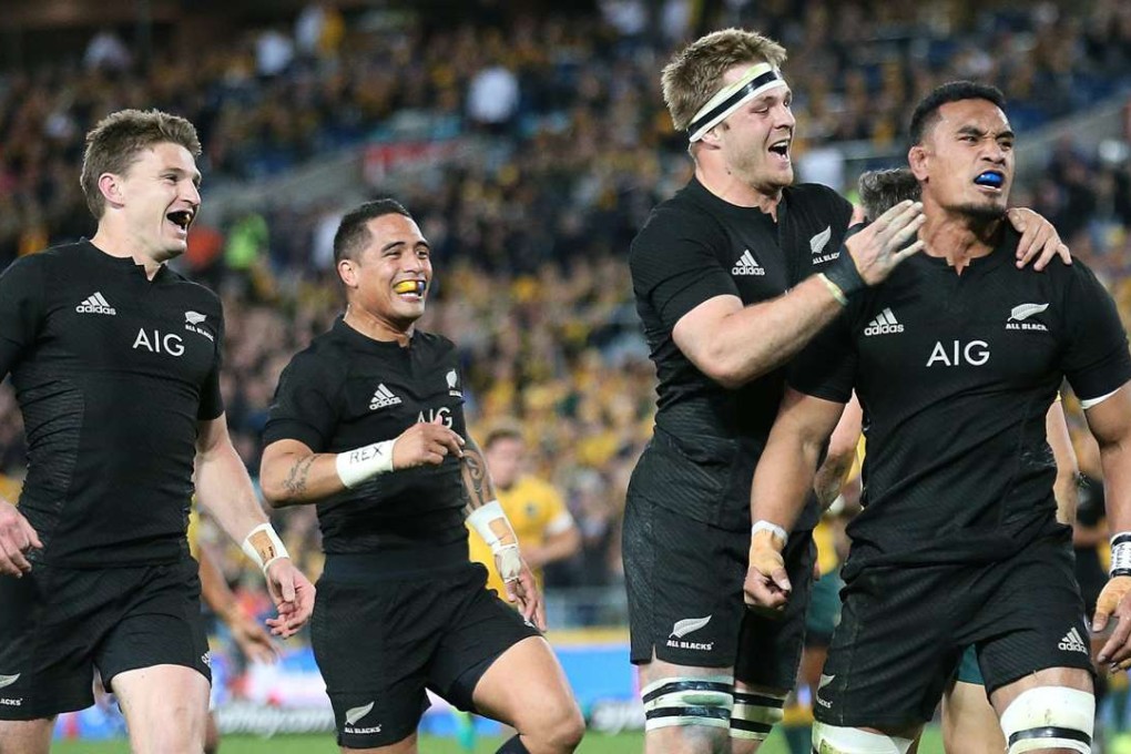 New Zealand's Jerome Kaino (right) celebrates with teammates after scoring a try against Australia in Sydney. Photo: EPA