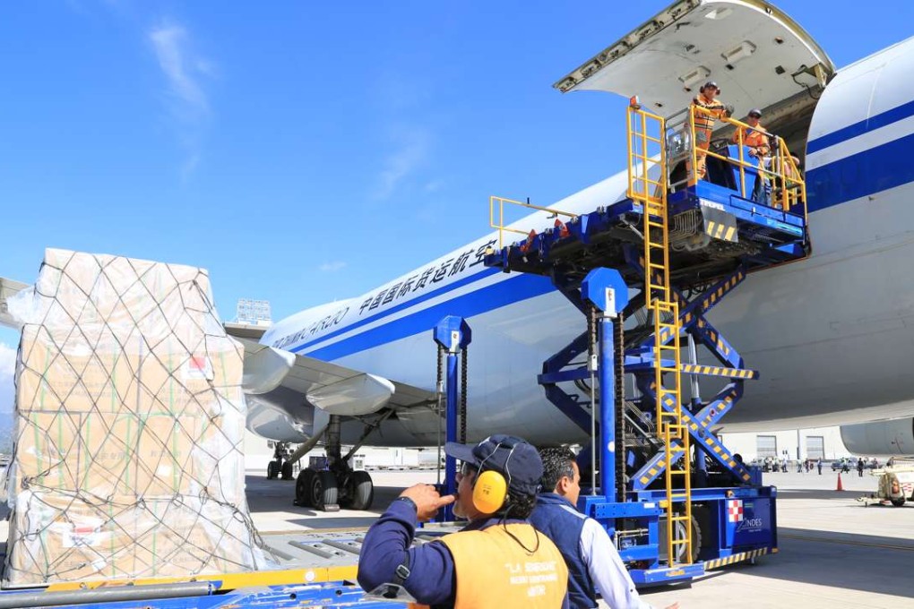 Airport staff unload humanitarian aid from China in Quito, Ecuador, in April last year. China delivered 60 million yuan of relief materials including tents and folding beds to the quake-ravaged country. Photo: Xinhua